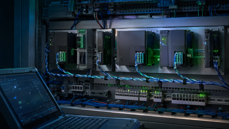 Commercial BAS control panel with BACnet MS/TP controllers and RS-485 network wiring.